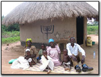 Abayuda family outside their hut